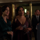 Carrie-Anne Moss as Jeri Hogarth and Sarita Choudhury as Kith Lyonne at a swanky gathering.